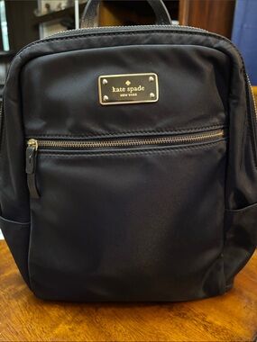 kate spade black nylon mini backpack with gold plaque and zipper